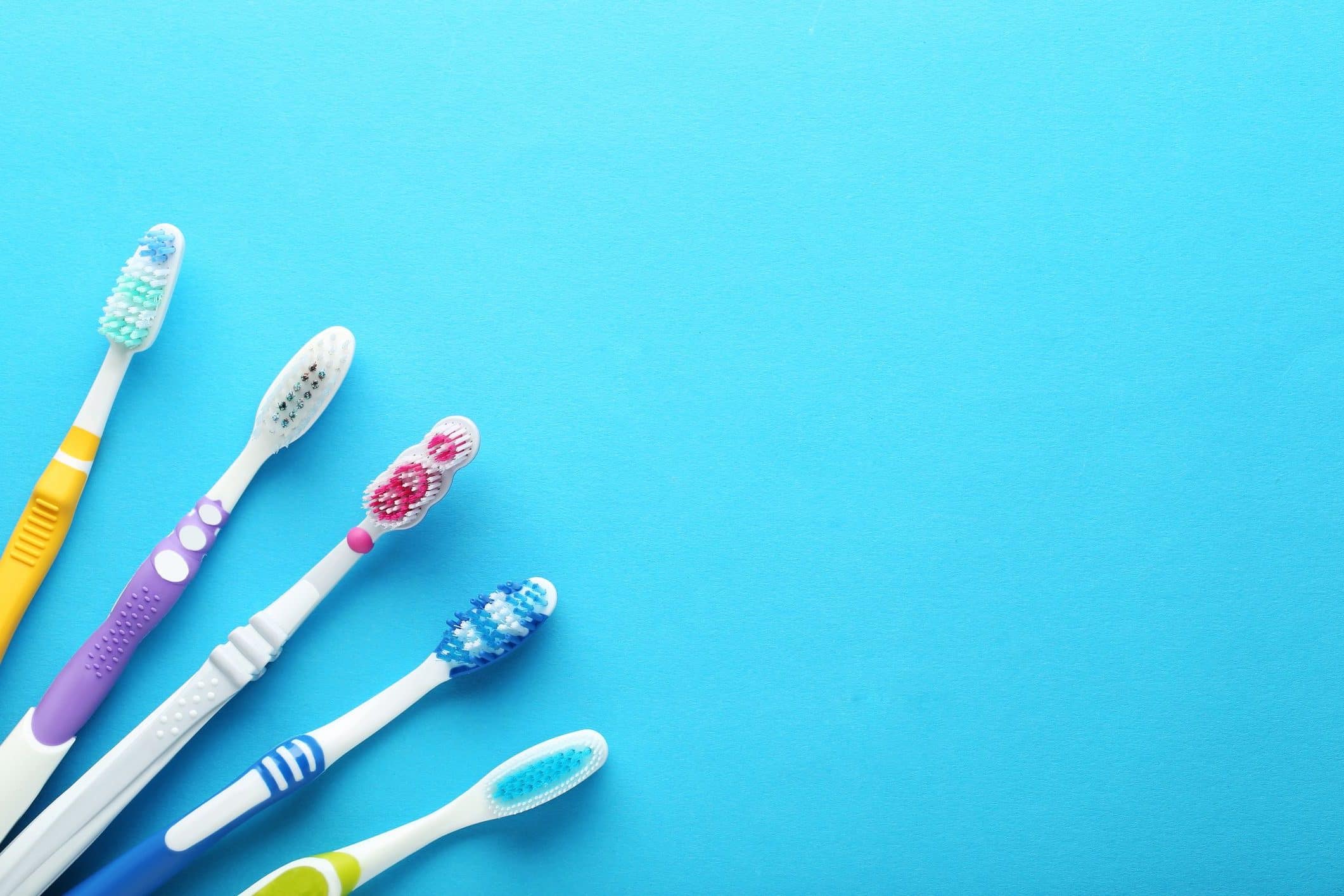 toothbrushes-on-blue-background-royalty-free-image